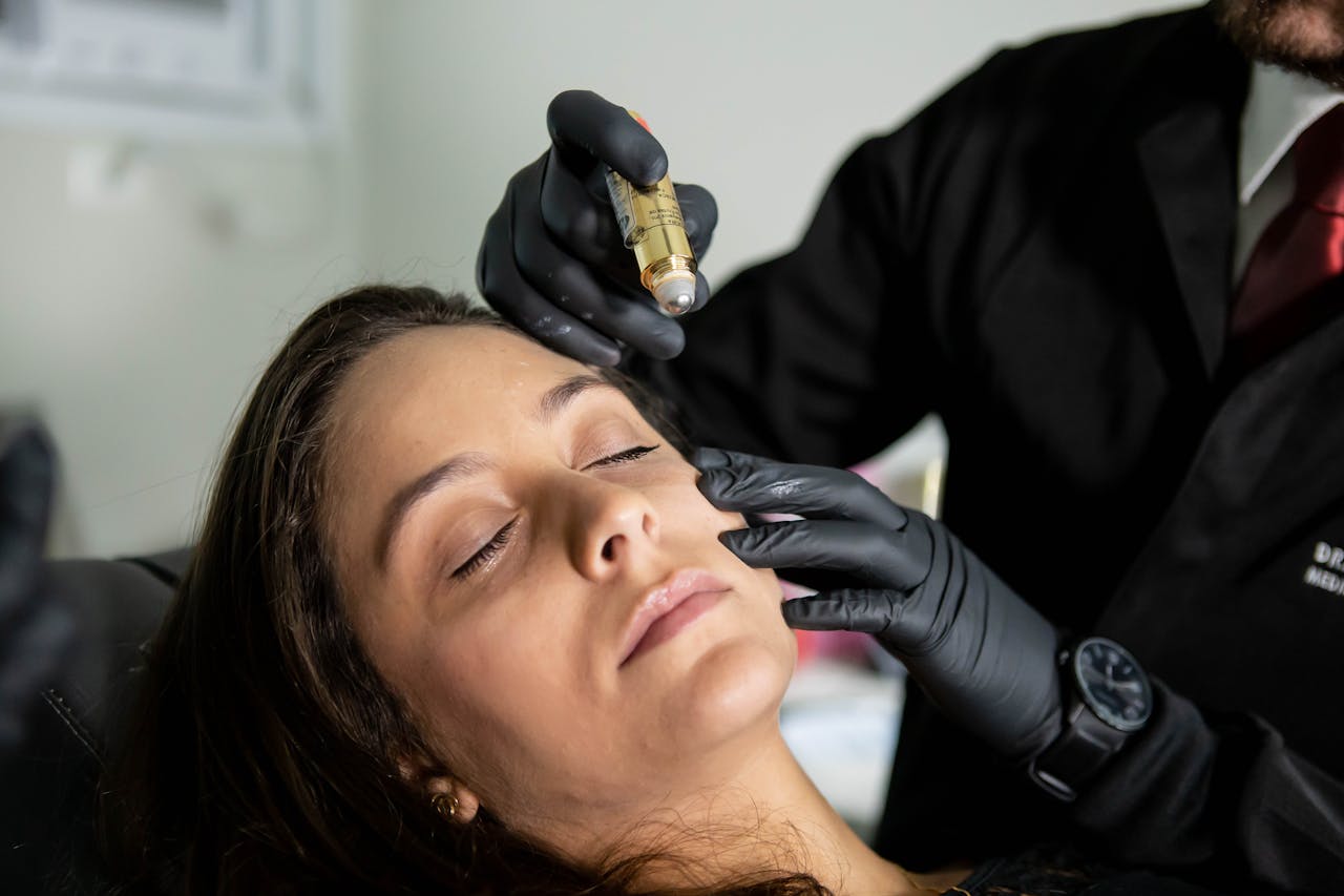 services-03 Close-up of a woman receiving a cosmetic skin care treatment in a clinic.